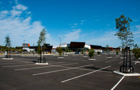 Newly paved parking lot of a mall.